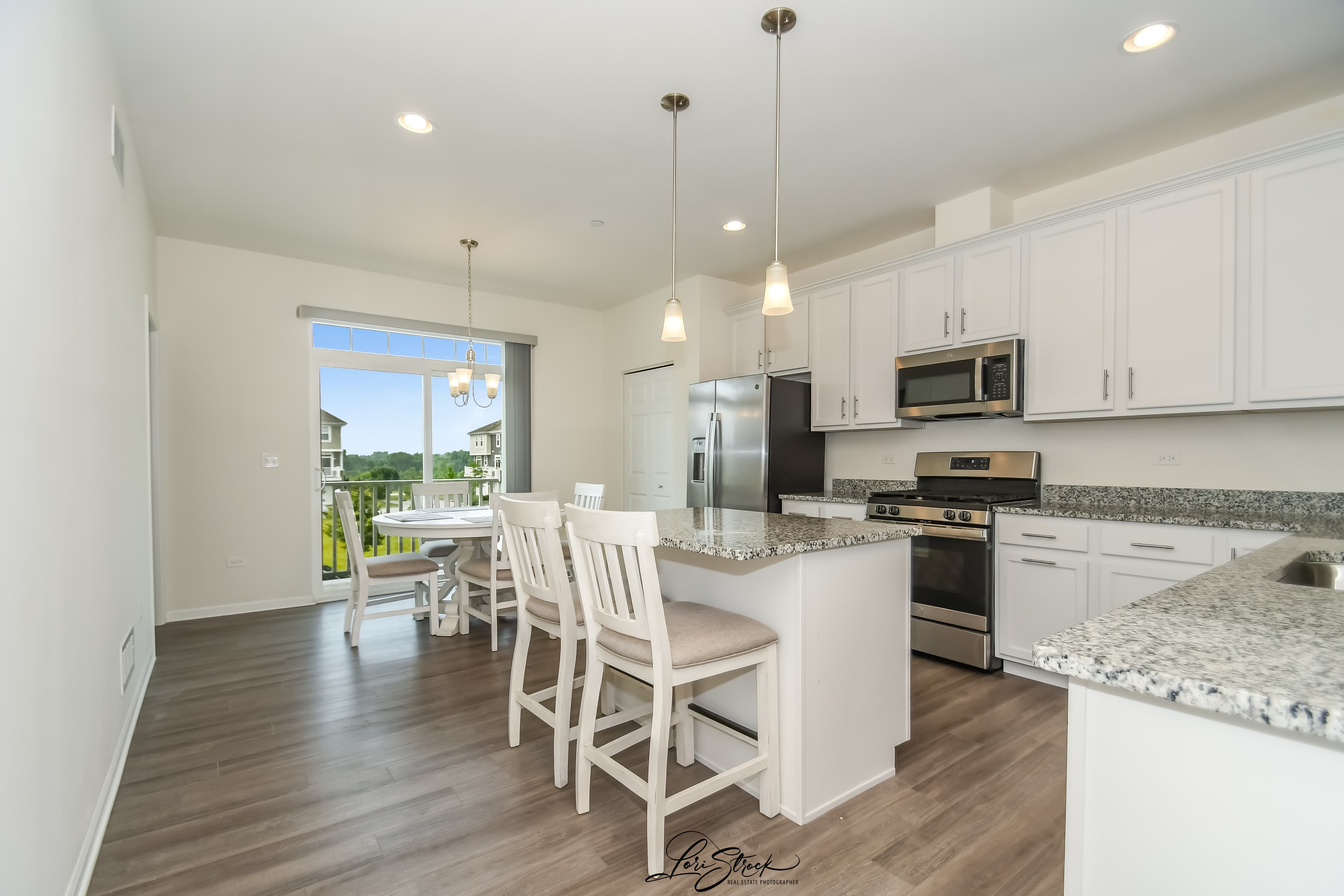 Updated kitchen with island and stainless appliances